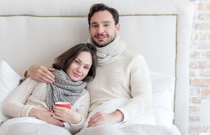 husband and wife relaxing in bed
