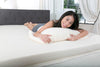woman lying on a latex mattress