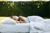 woman sleeping in meadow